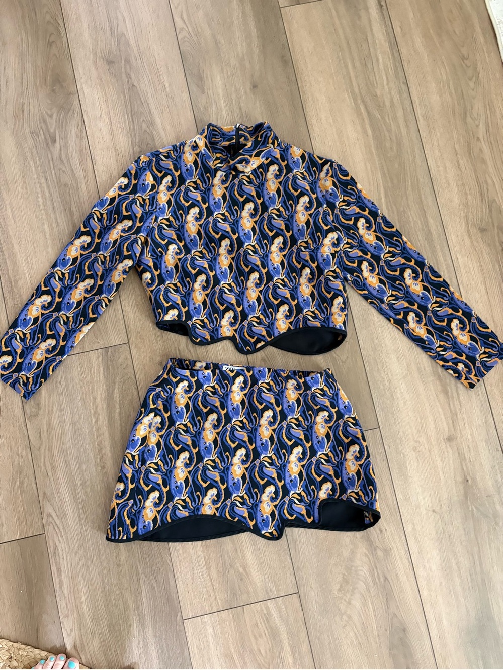 Zara Blue and Gold Patterned mini skirt and long sleeve crop. Asymmetric cut